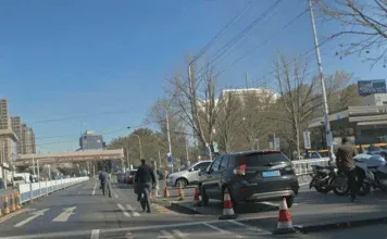 JoinAI Simulaix generated daytime road scene 1, showing a busy city street with traffic cones.