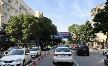 JoinAI Simulaix generated daytime road scene 2, showing a busy city street with traffic cones.